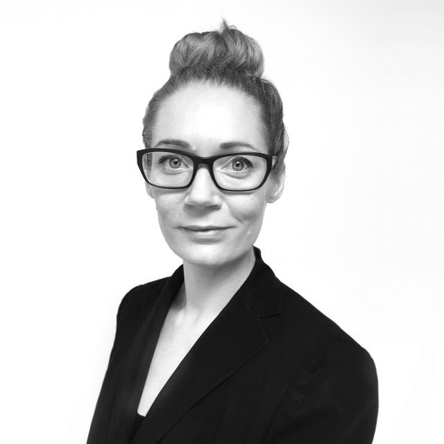 DMA faculty member Rhonda Holberton smiling with glasses.