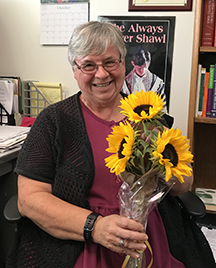 Mary holding sunflowers