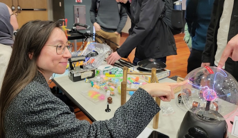 Student with plasma ball