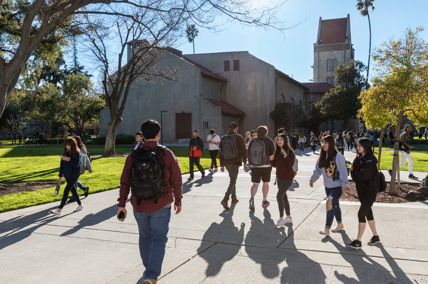 students walking near tower hall