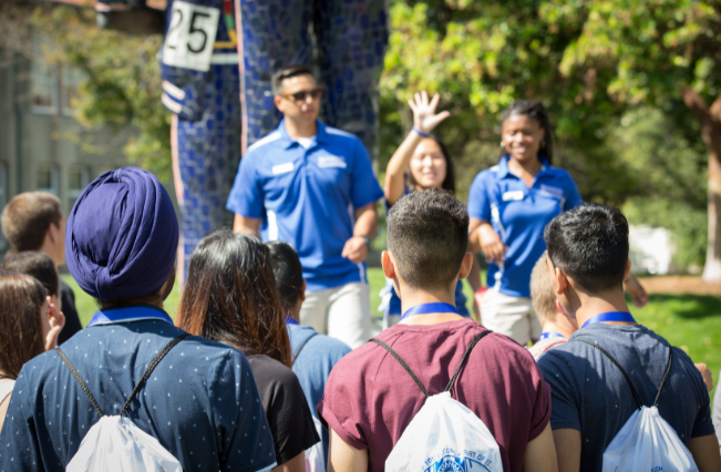 Group of students being toured around campus.