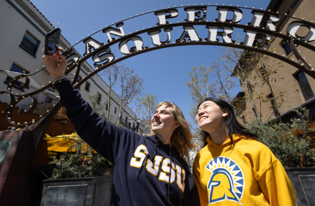 Students taking a selfie at the San Pedro Square gate.
